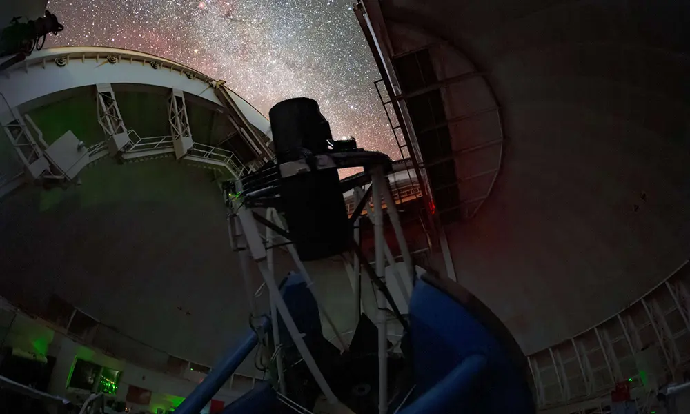 The Dark Energy Spectroscopic Instrument (DESI) pointed upward toward the night sky to make observations.