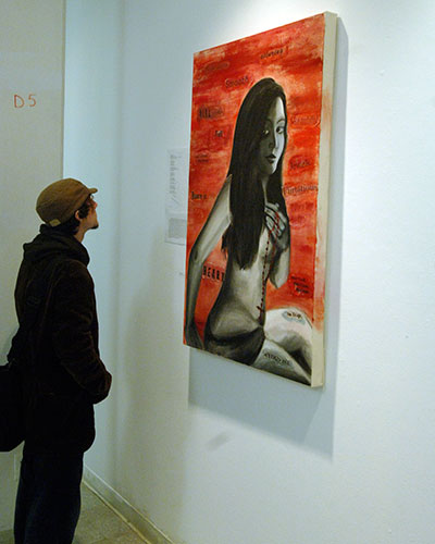 A student viewing a painting