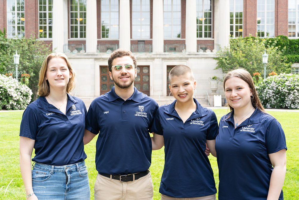 2026-27 Orientation Leaders pose in front of Rush Rhees Library on Eastman Quad