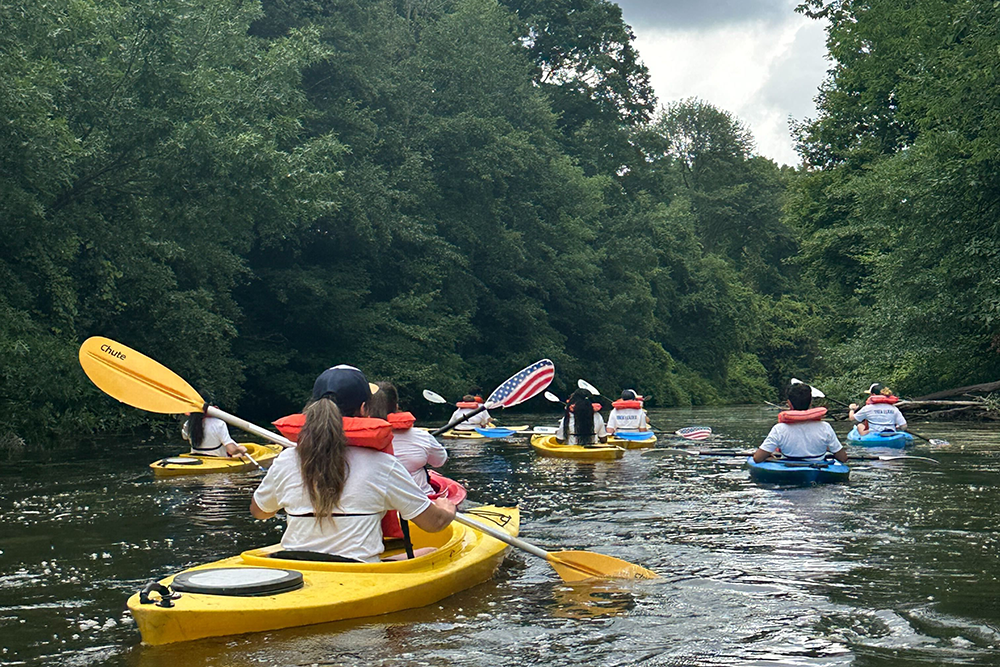 Students kayak along the Genesee River during the 2025 FOOT program