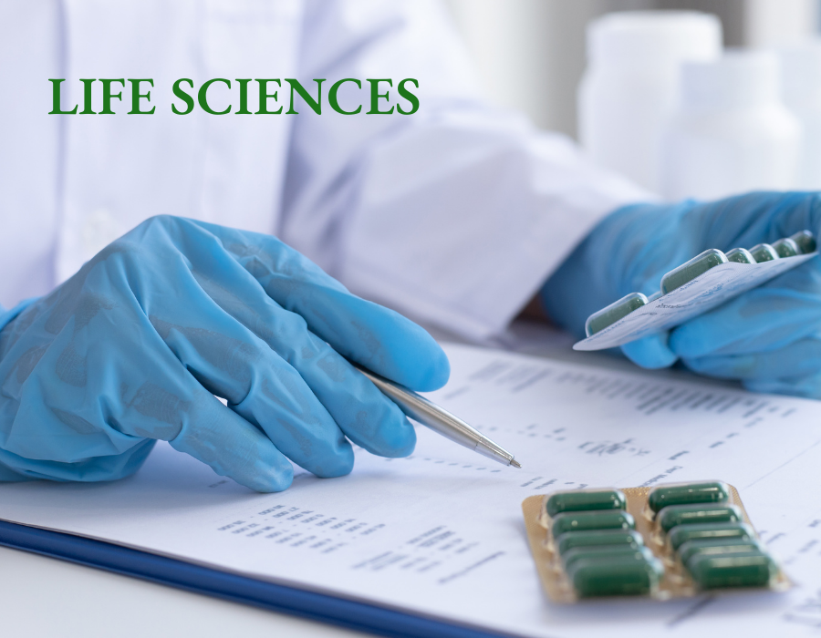 Gloved hands checking a list while holding packets of pills with the words Life Sciences overlayed in green.