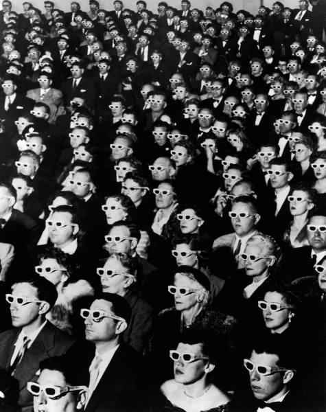 Moviegoers wearing 3D glasses.