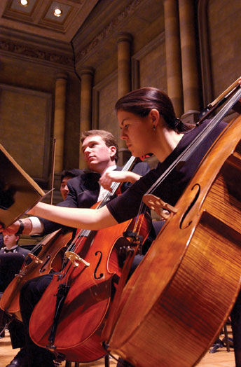 musicians playing cellos