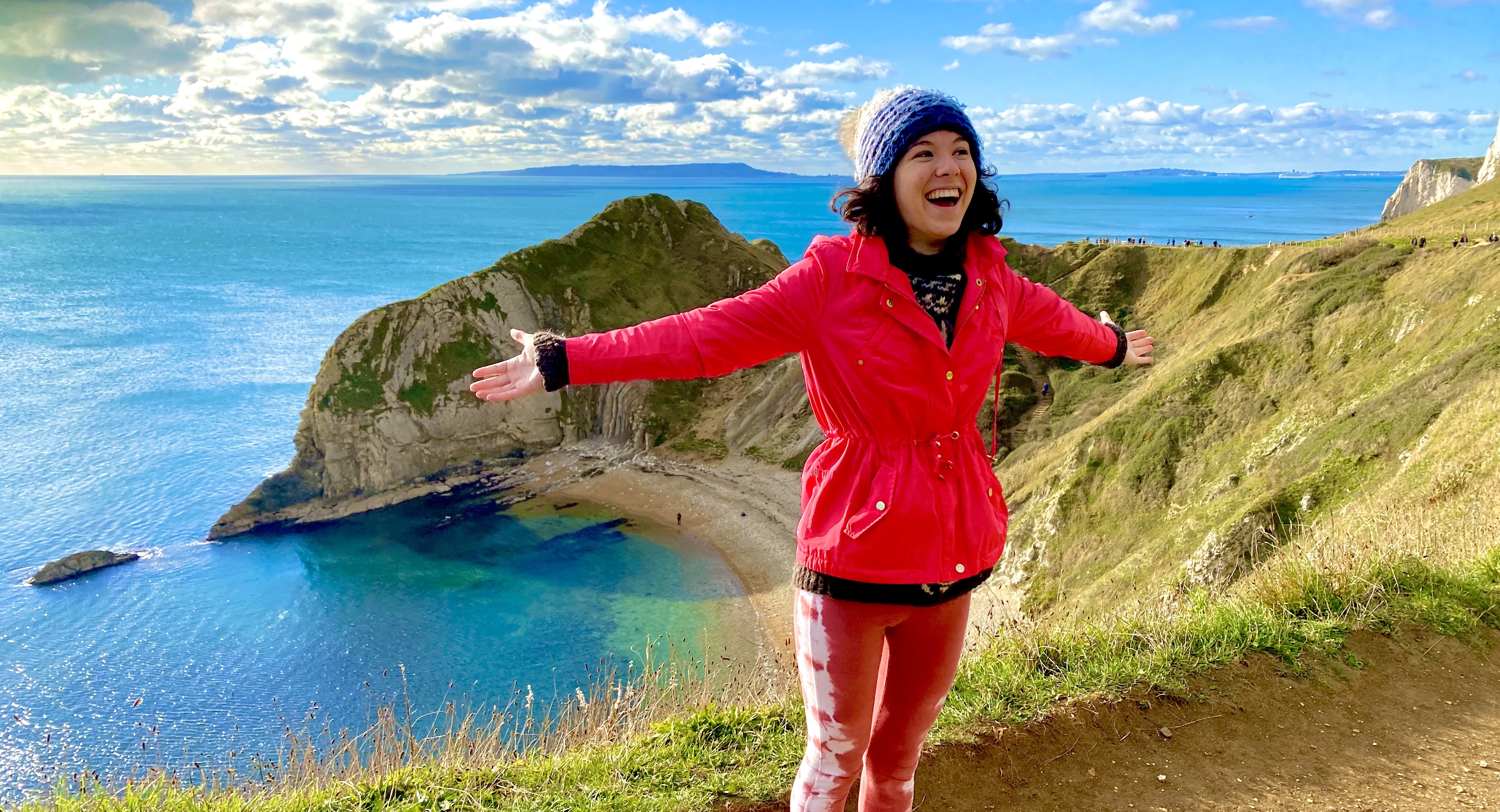 Study abroad student Elizabeth Winterbourne standing on the Jurassic Coast in England. 