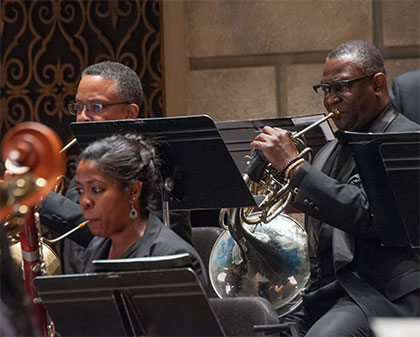 African-American musicians playing wind instrument