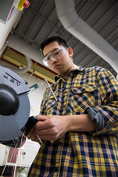 Student grinding a hinge