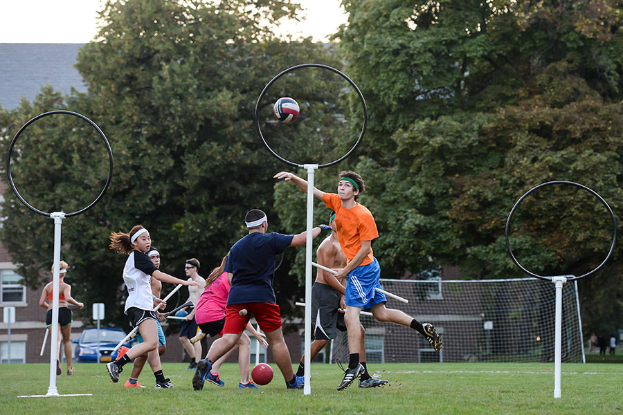 A player trying to score during a quidditch match.