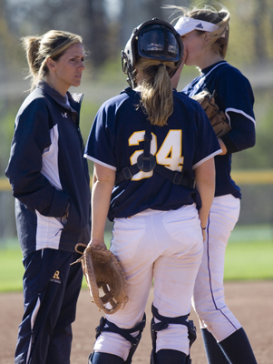 Yerdon (l.), shown here with Megan Winn (c.) and Carly Hoffend (r.) helped Rochester pitchers excel.