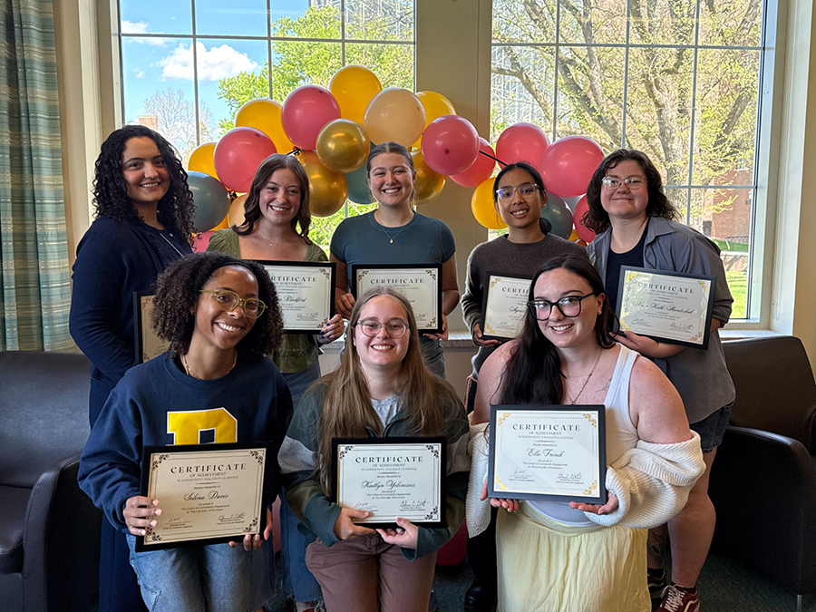 All recipients gathered together smiling at the camera.