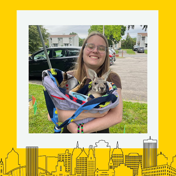 The recipient smiling at the camera with a thick yellow border around the image.