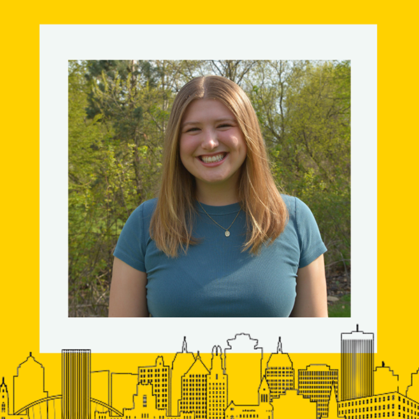 The recipient smiling at the camera with a thick yellow border around the image.