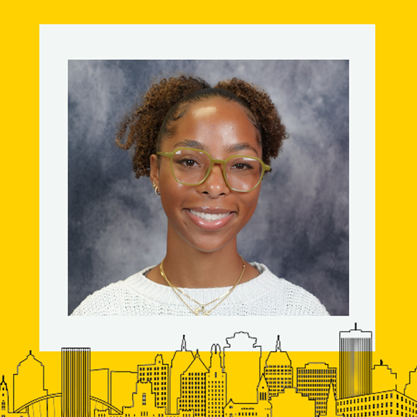 The recipient smiling at the camera with a thick yellow border around the image.
