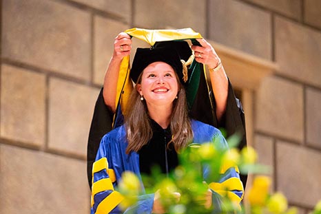 A woman receiving honors at commencement.
