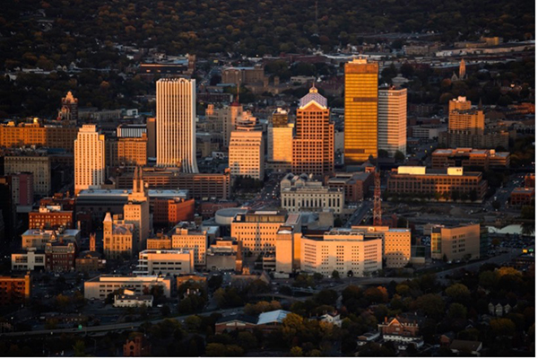 An aerial view of downtown Rochester at sunset.