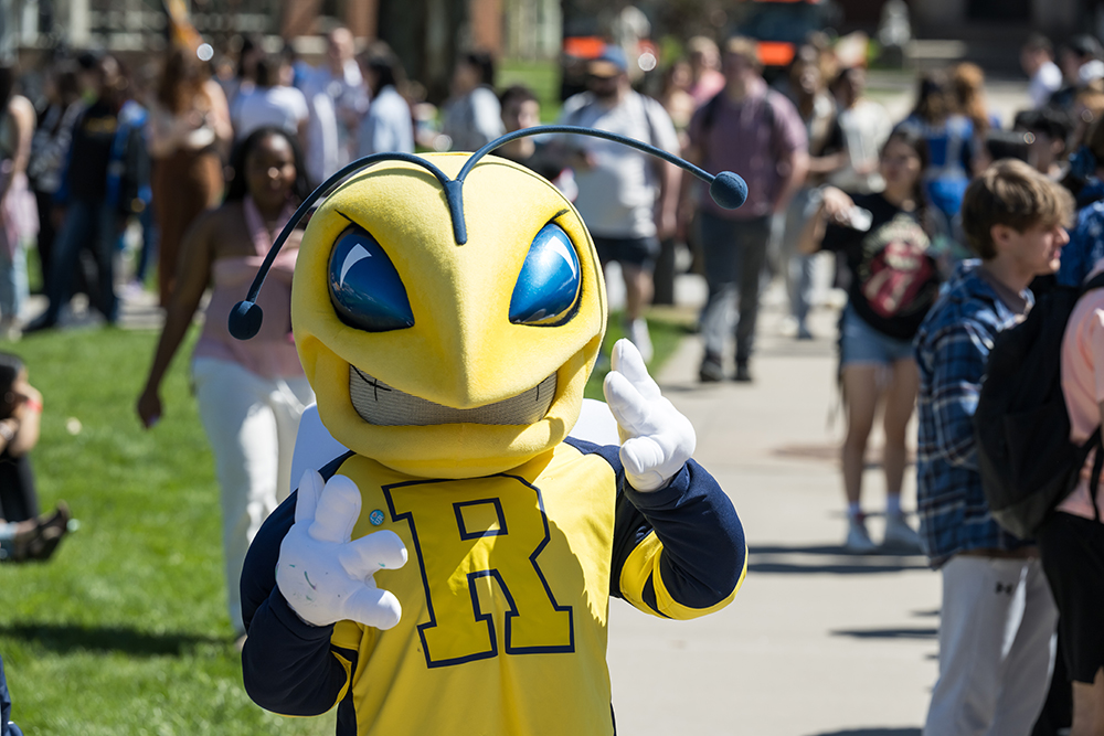 The school mascot grinning at the camera.