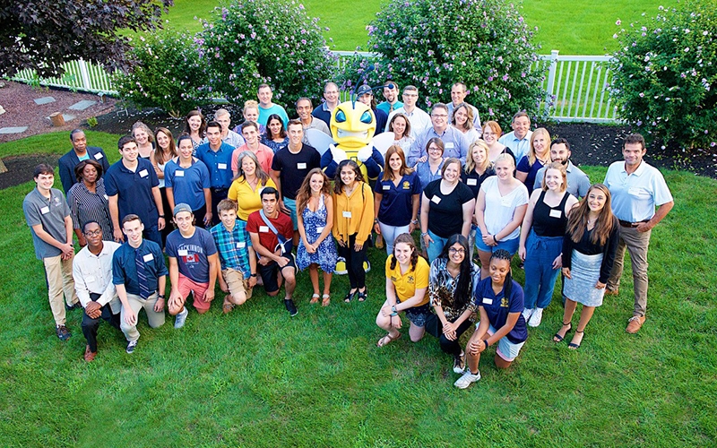 Incoming students and families pose with Rocky at a previous Welcome Celebration.