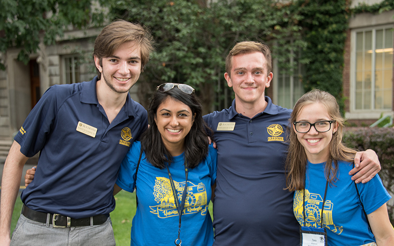 Photo of former Orientation Leaders and Welcome Week Leaders posing on Eastman Quad during Fall Welcome Week