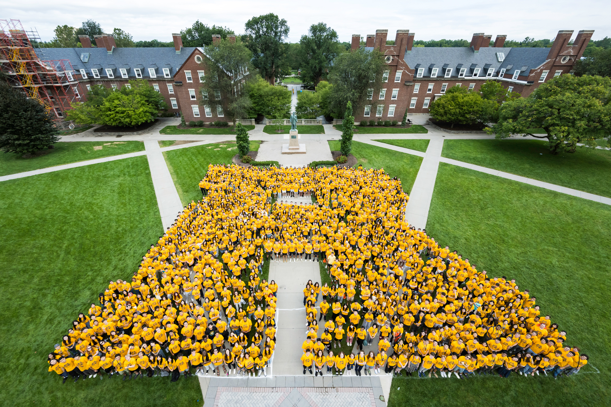 New fall 2023 students pose in the shape of an R on Wilson Quad