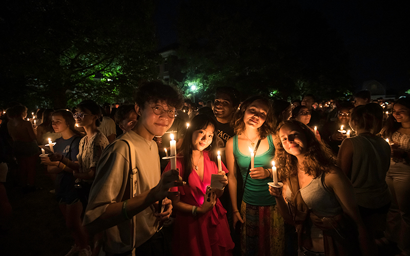 Photo of students holding candles during the Candlelight Ceremony during Fall 2022 Welcome Week