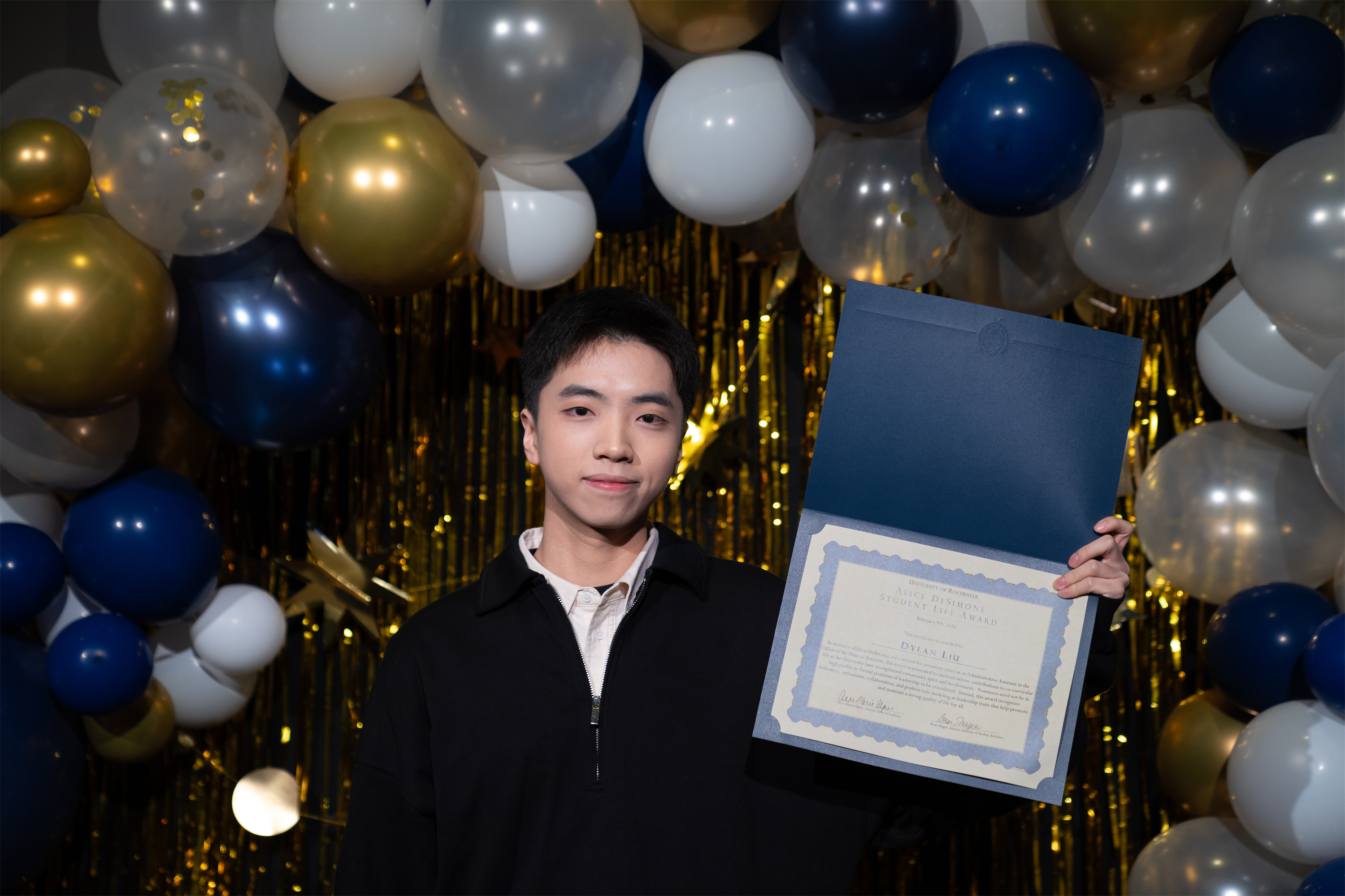 Dylan Liu accepting award