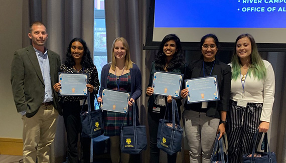 Graduate Research Day prize winners and Dean Nick Vamivakas 