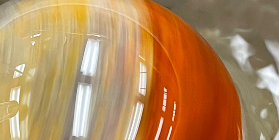 Orb with orange and yellow swirls.