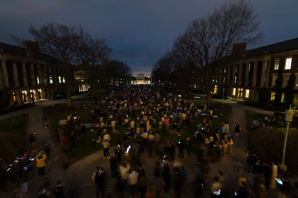 People gathered outside of Rush Rhees Library and on the Eastman Quad during totality of the eclipse 