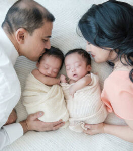 Sherry Tsang, with her twin boys and husband. 
