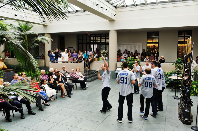 singing group performs in the art gallery atrium