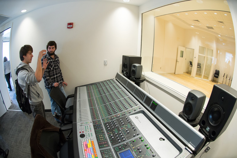 students look over a recording studio