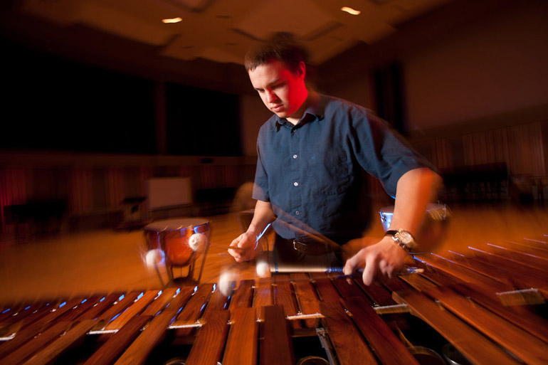 student plays the marimba