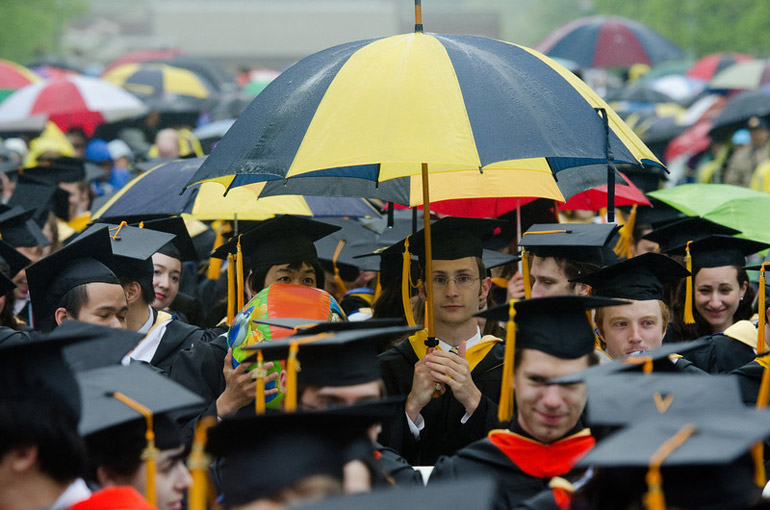 graduates in the rain