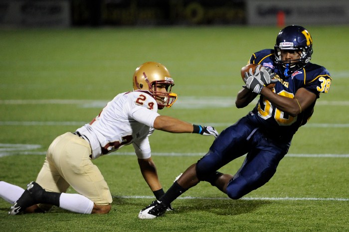 football players taking a fall