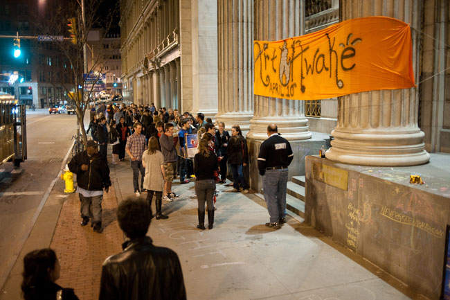 crowds wait to enter bank building