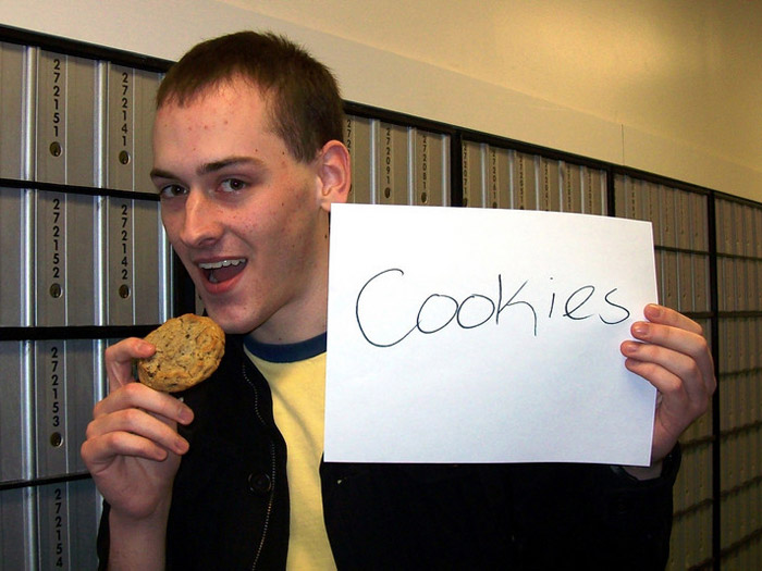 student holding sign that reads COOKIES