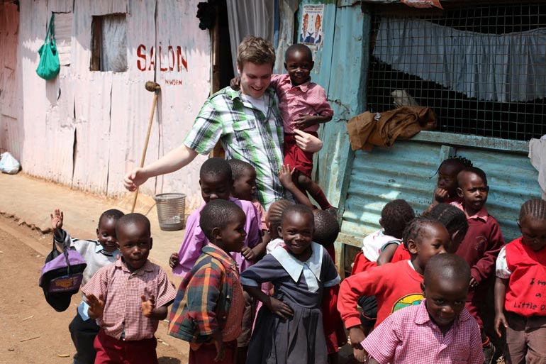 student meets African school children