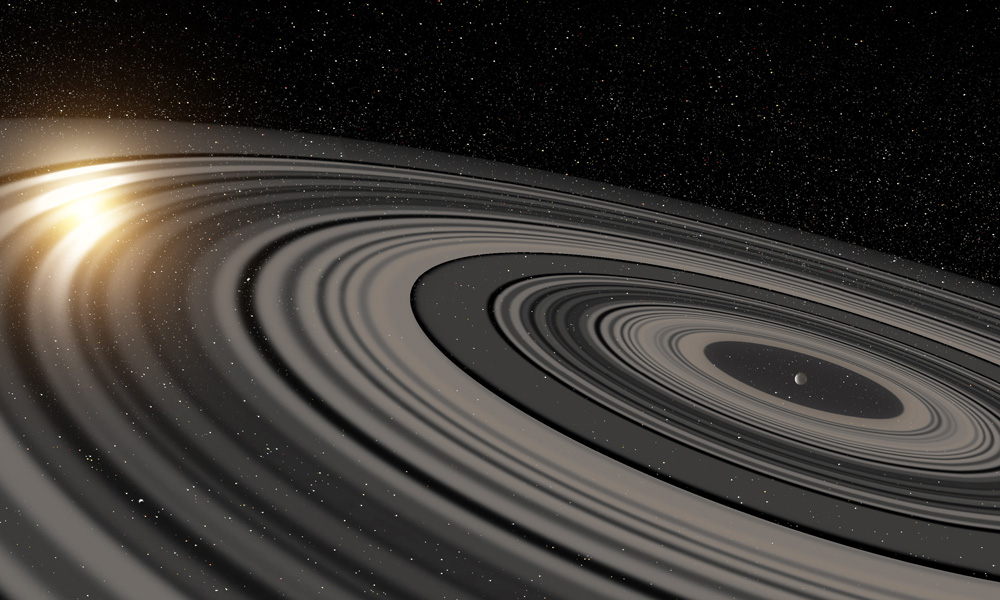 Artist’s conception of the extrasolar ring system circling the young giant planet or brown dwarf J1407b. The rings are shown eclipsing the young sun-like star J1407, as they would have appeared in early 2007. Credit: Ron Miller