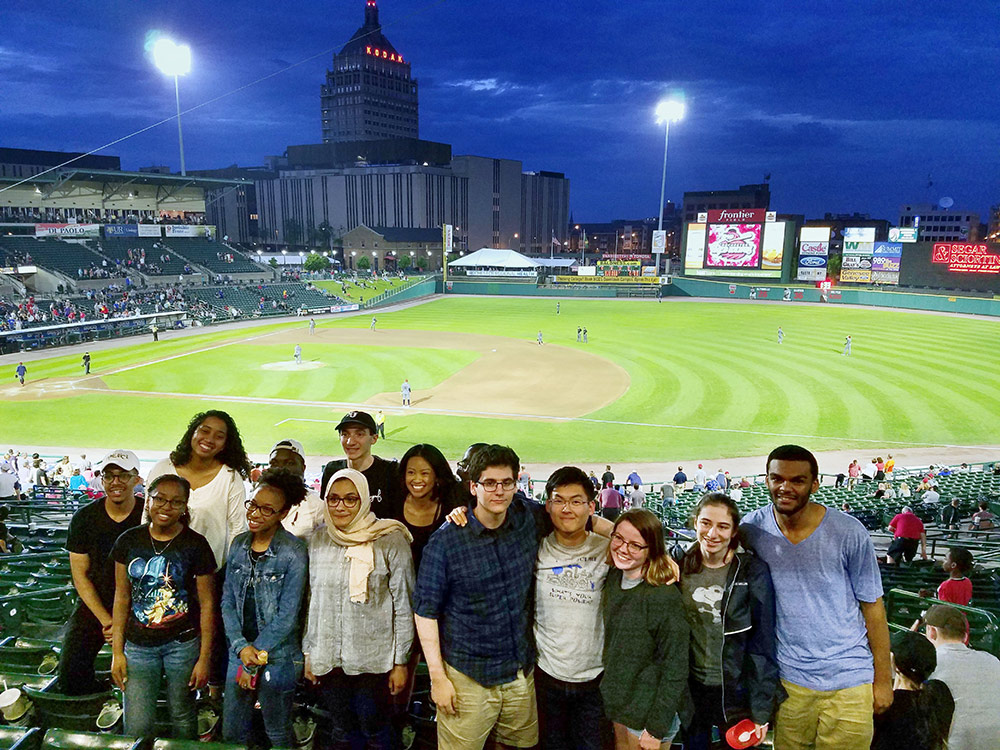 group poses for a photo at baseball stadium