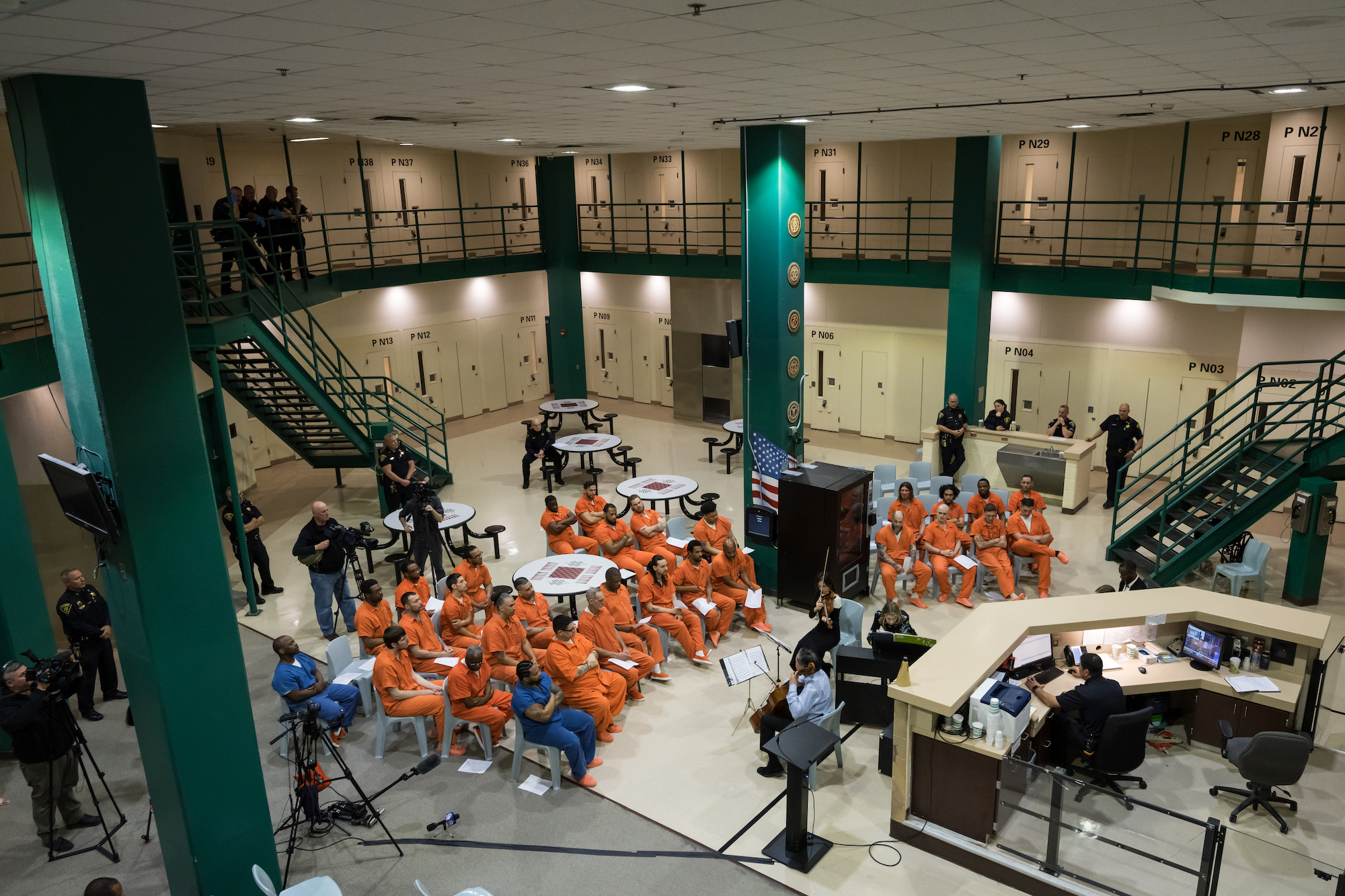 Inmates in the rehabilitation unit at the Monroe County Jail listen to music performed by an ensemble 