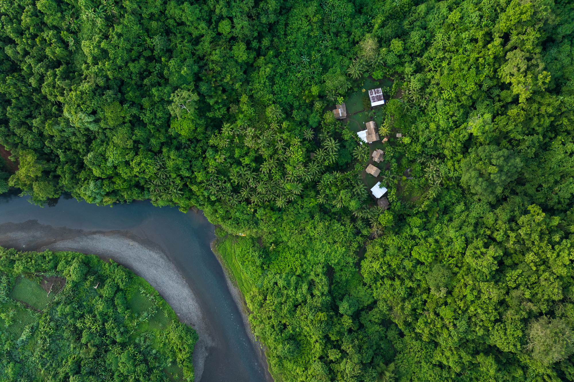 Aerial drone view of Hariga River and Hariga Village, Makira Island, Solomon Islands
