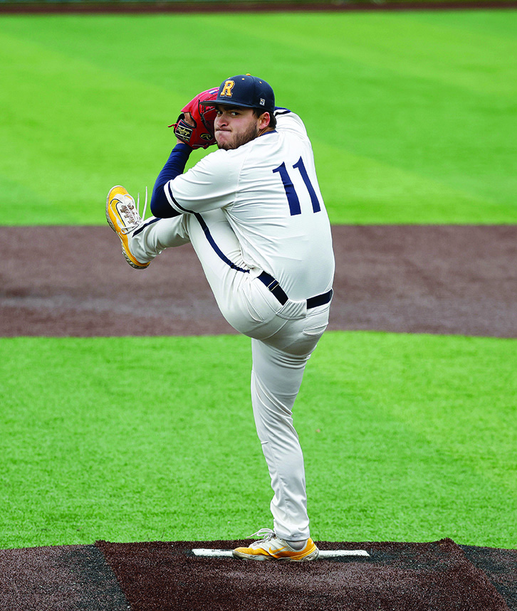 Nolan Sparks on mound in Yellowjackets uniform just before pitch.