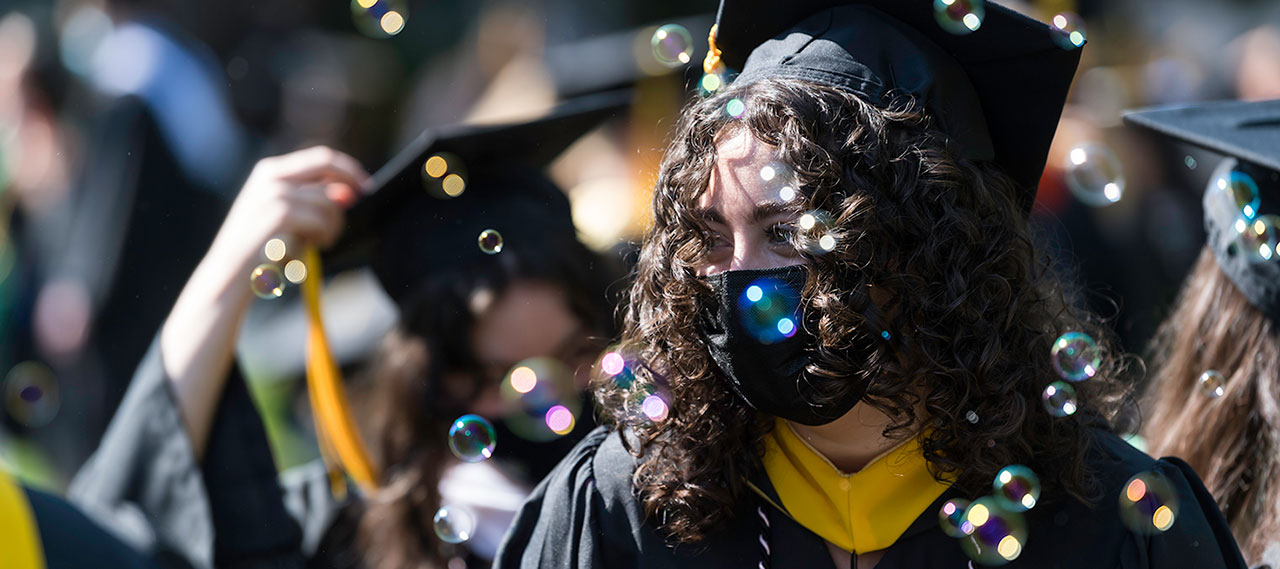 Students seen through bubbles at commencement.