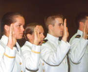 Allegiance: Regan (left) and fellow cadets swear to defend the Constitution of the United States during the commissioning ceremony.