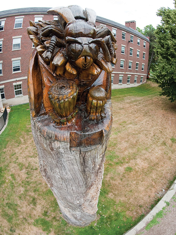 carving of a yellowjacket on the campus of the University of Rochester