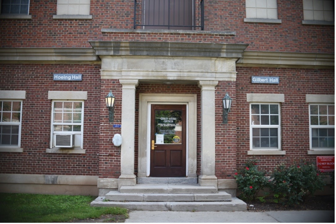 An exterior view of the entrance to the Quad area office between Hoeing and Gilbert Halls.