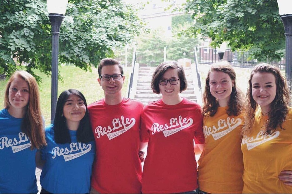 A group of student staff pose for the camera.