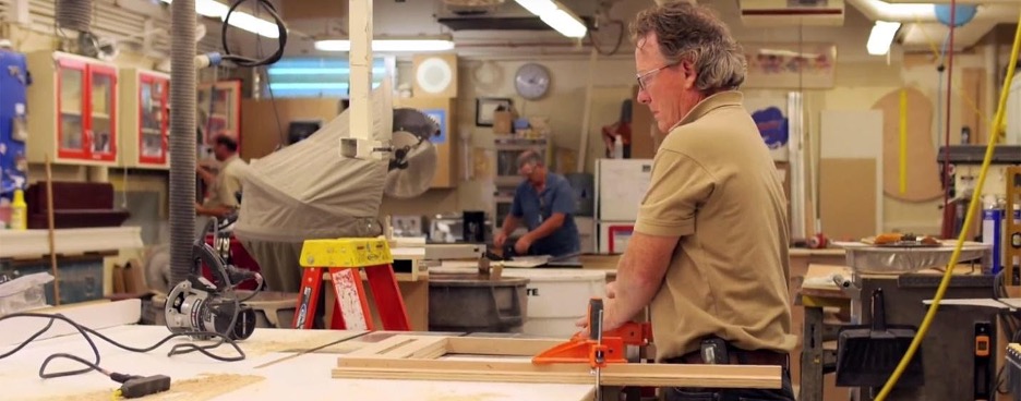 A woodworker building a cabinet.