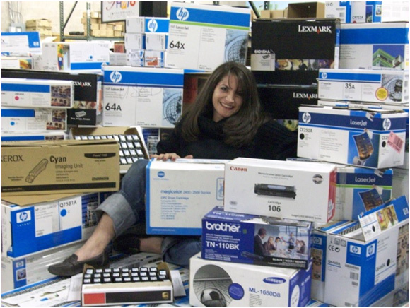 woman sitting on inkjet boxes