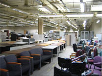 photo of surplus chairs, tables and desks