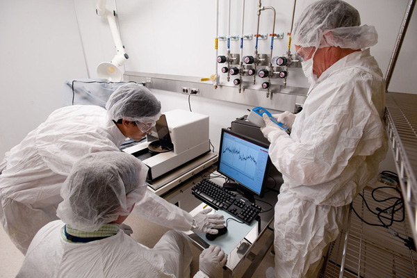Researchers working in a cleanroom.
